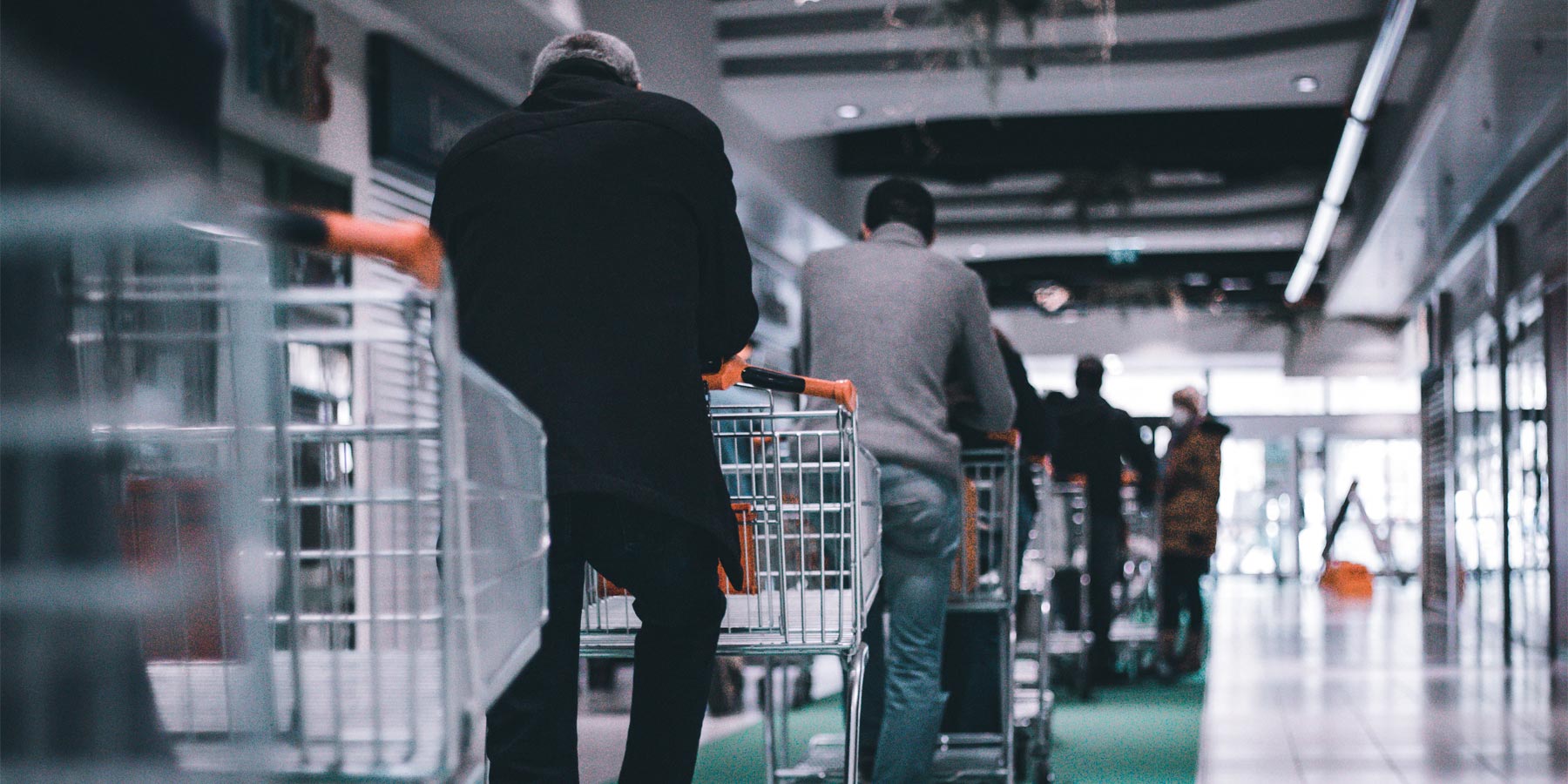 People Queuing Outside Supermarket